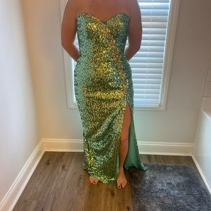 Beautiful green sequin dress. Lovely slit